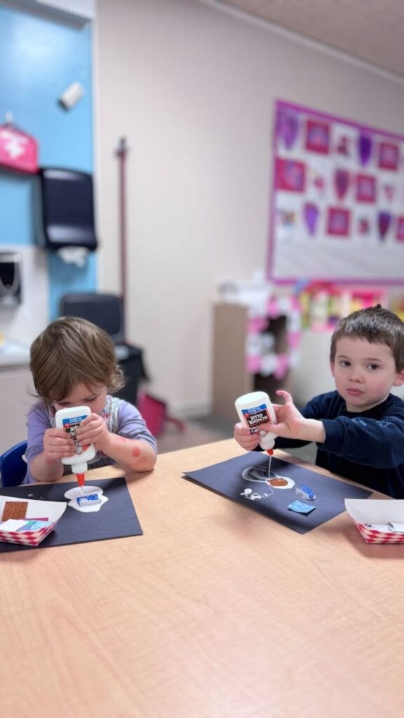 toddlers glue their craft at a table at a napa preschool